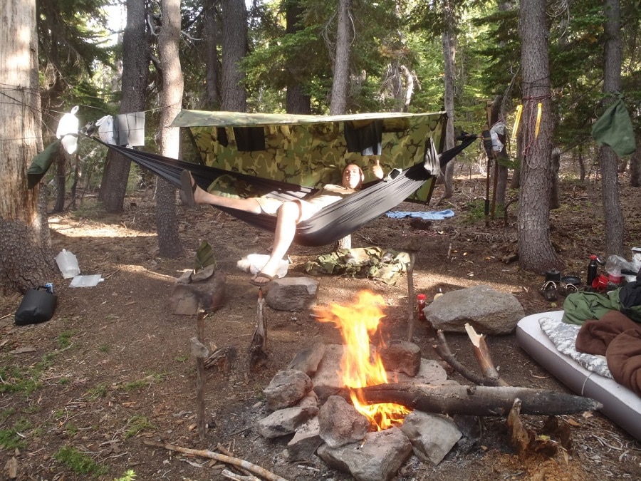 Drying clothes around campfire