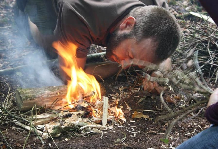 Lighting a fire in forest