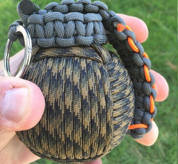 Paracord survival grenade in the hand