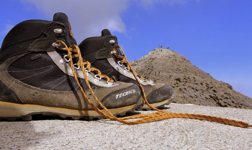 Hiking boots lying on top of the mountain