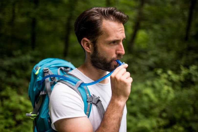 Man drinking water from CamelBak
