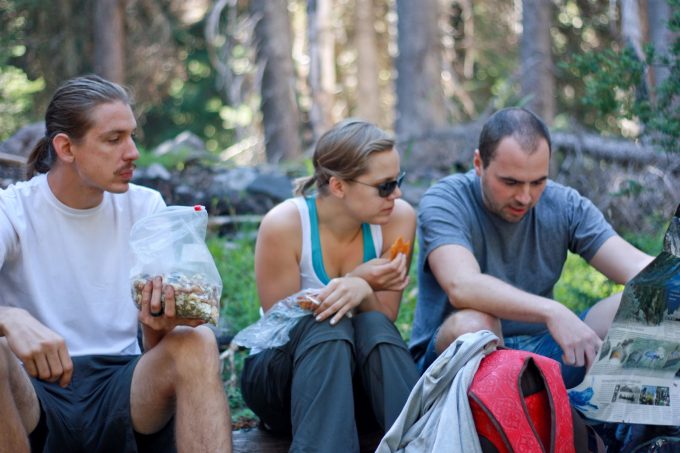 3 people eat hiking snack