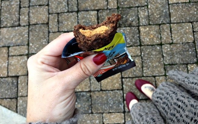 Hand holds chocolate bar