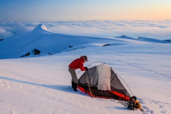 Setting up tent on the snow