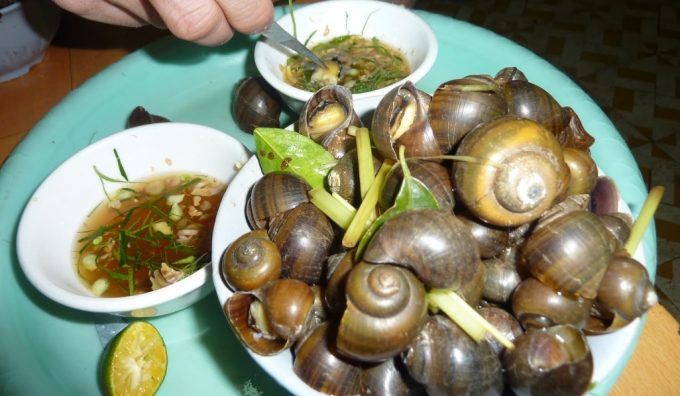 adding spices on cooked snails.JPG