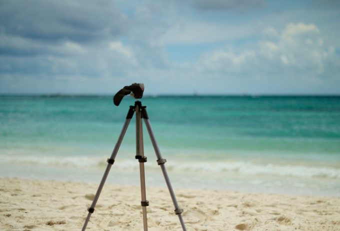camera tripod on the beach