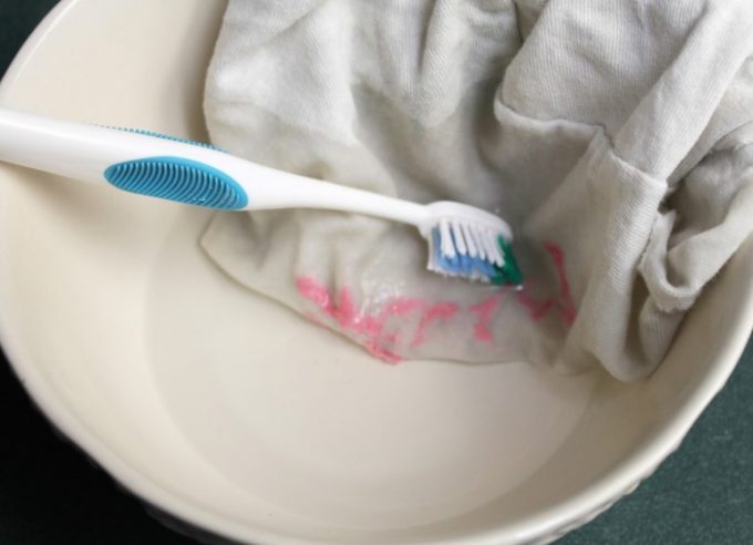 removing stains with toothbrush