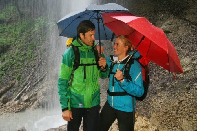 Couple hiking in the rain