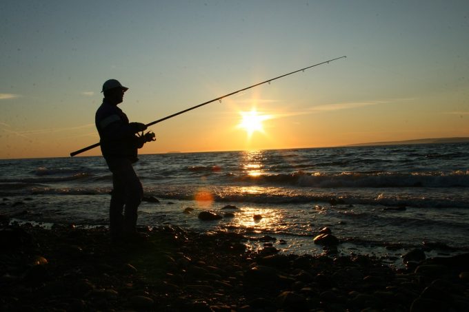 man fishing on the coast