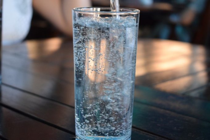 pouring mineral water into glass
